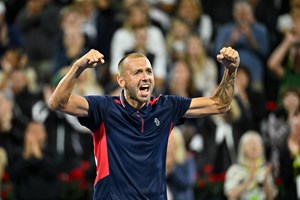 Dan Evans celebrates a win on court