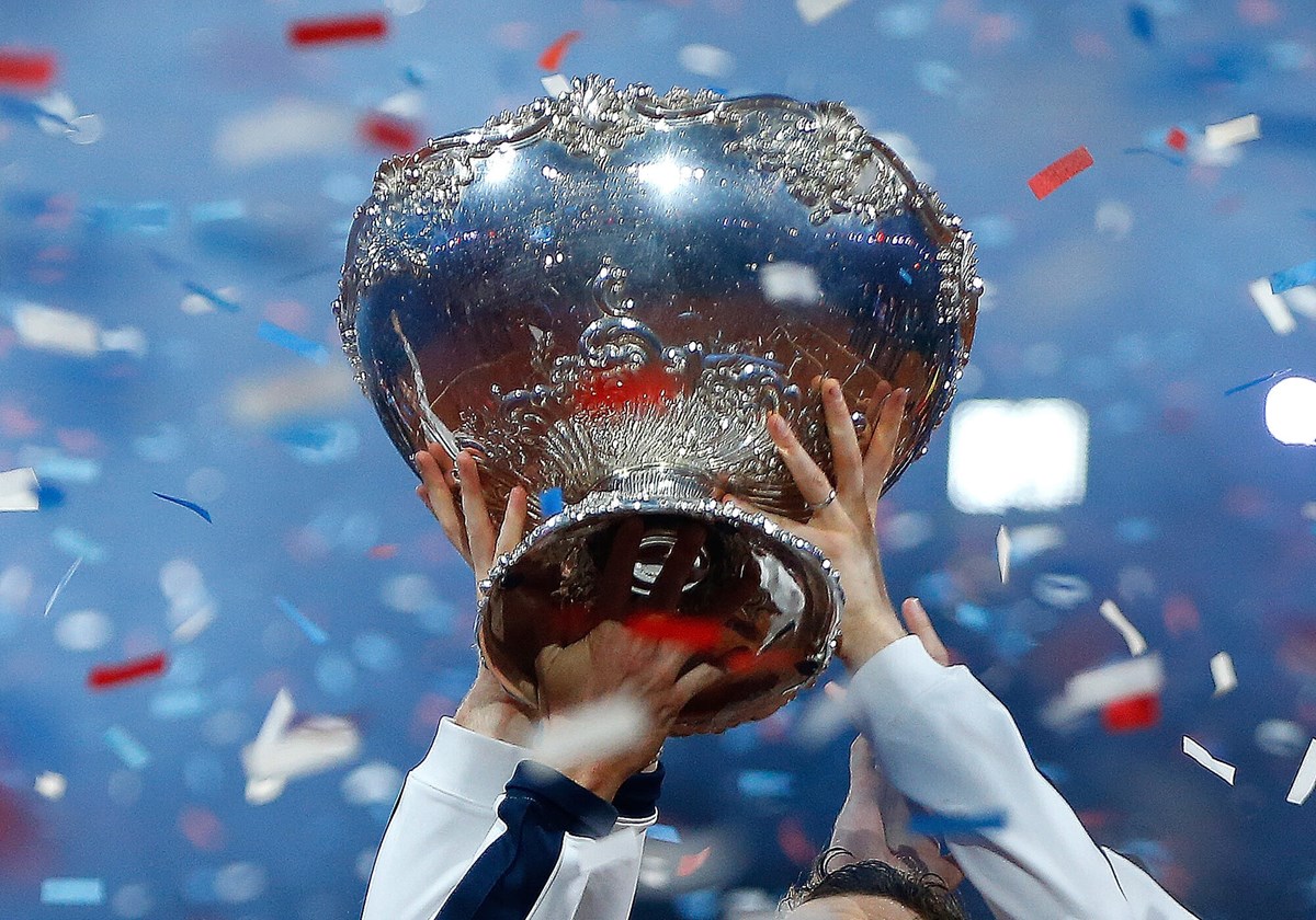 Close up of player holding up Davis Cup.jpg