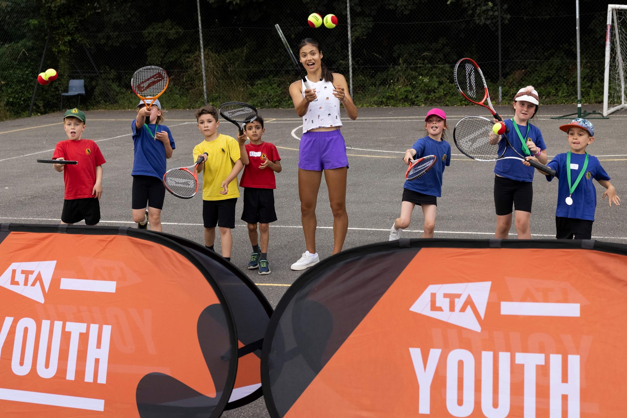 LTA Youth Ambassador, Emma Raducanu, on court with the Juniors on court