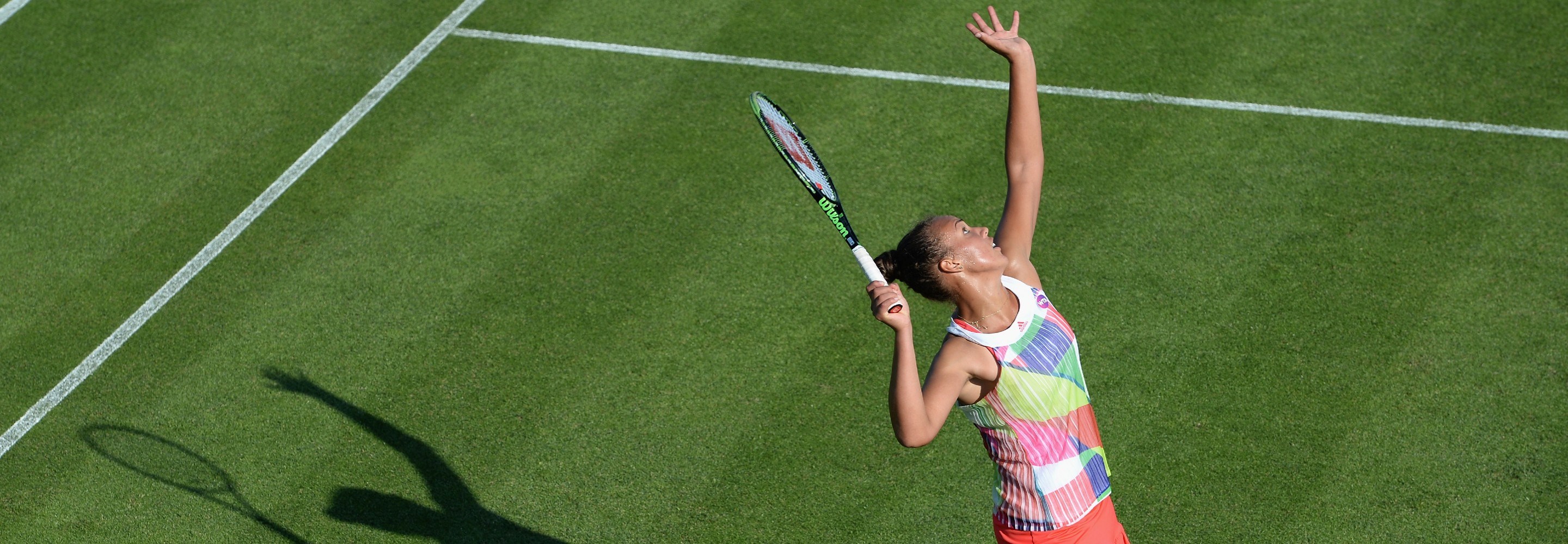 Freya Christie of Great Britain serves