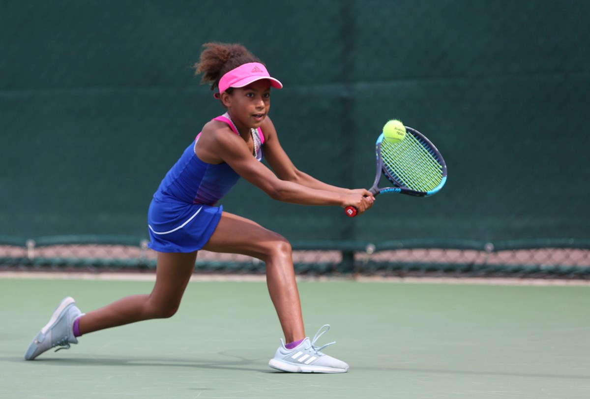 Junior-player-stretching-for-backhand.jpg