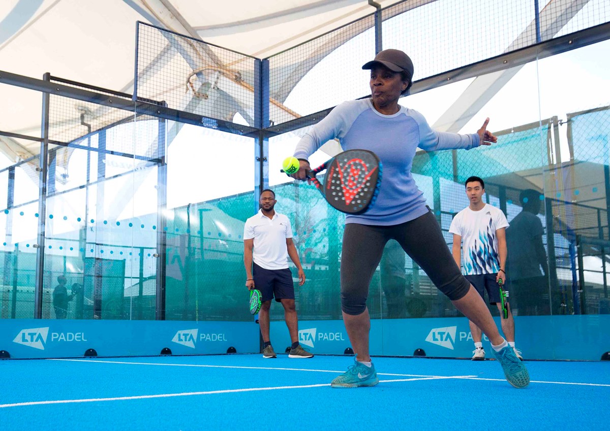 Padel player hitting a backhand